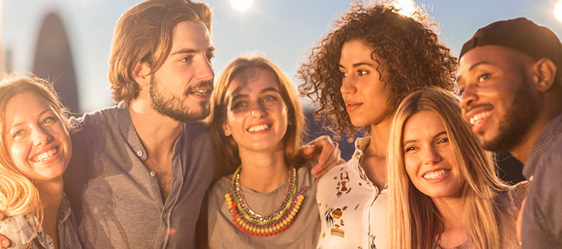 group of young people standing around